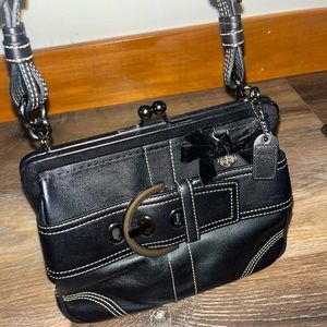 This vintage coach mini purse has barely been used.